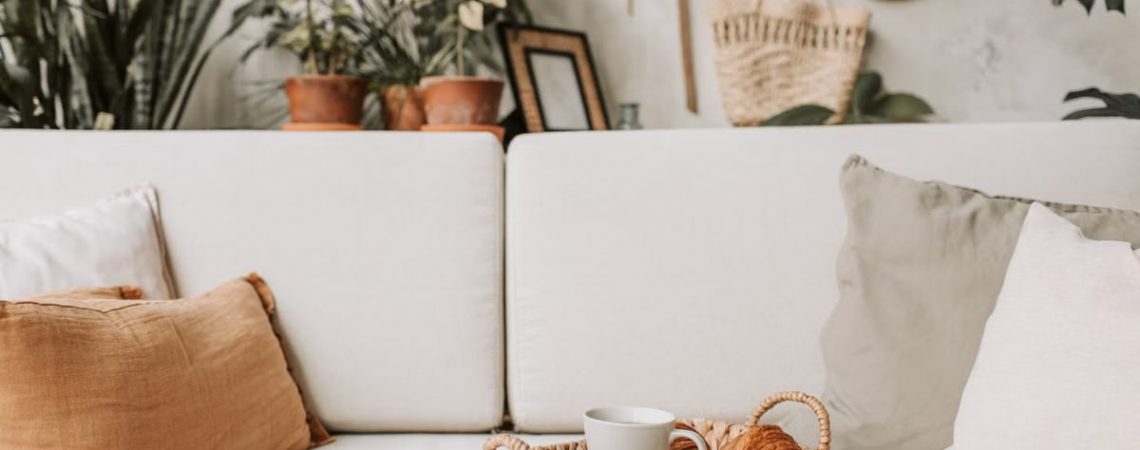 Cozy living room scene with coffee and croissants. Ideal for lifestyle and home decor concepts.